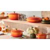 imageLe Creuset Enameled Cast Iron Signature Oval Dutch Oven 675 qt Flamme Doree with Crucible Knob5 qt